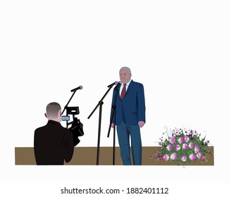 
an elderly man performs on a stage decorated with flowers. It is filmed by the operator on a video camera