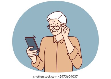 Elderly man with poor eyesight squint looking at screen of mobile phone to read SMS. Grandpa is having vision problems due to cataracts in eyes and needs help of ophthalmologist doctor