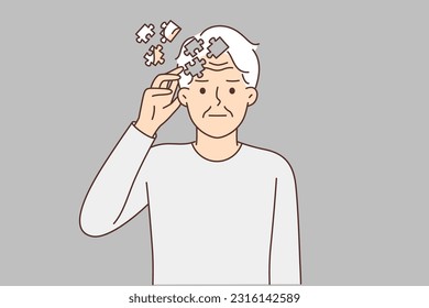 Elderly man with puzzles near head, symbolizing dementia, suffers from memory problems or alzheimer disease. Old man needs help of doctor or drugs to treat dementia caused by advanced age.