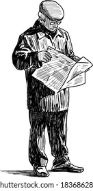 elderly man reading a newspaper