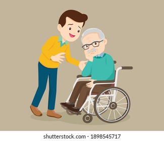 elderly man sit in a wheelchair and the son tenderly puts  hands on him shoulders. Man cares for father.Careful caregiver taking care of the patient. man consoling Grandfather