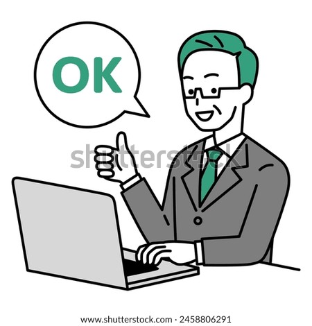 An elderly man in a suit working on a laptop giving an OK sign