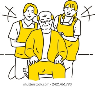 An elderly man in a wheelchair and his male and female caregivers smiling and cuddling together