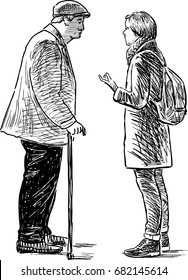 An elderly man and young girl are talking