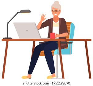 Elderly parents sitting at computer and talking to daughter. Online communication via Internet