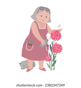 An elderly, plump, satisfied woman takes care of flowers in the garden. There's a kitten nearby. Grandmother sprays phlox.