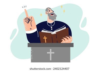 Elderly priest with bible in hands stands behind pedestal with christian crucifix and reads sermon calling faithful to liturgy. Man priest points finger up reminding importance of worshiping god