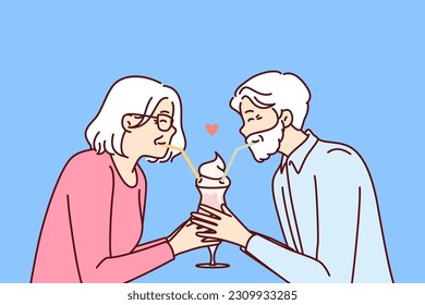 Elderly romantic couple drinking cocktail from straws together enjoying retirement and dating on eve of february 14th Valentine day. Romantic grandparents show love between elderly