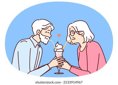 Elderly romantic couple drinking cocktail from straws together enjoying retirement and dating on eve of february 14th Valentine day. Romantic grandparents show love between elderly