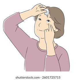 Elderly woman applying eye drops