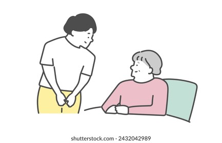 Elderly woman in bed with female caregiver