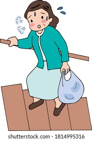 Elderly woman climbing stairs with luggage