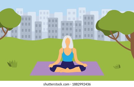 Elderly woman doing yoga in park
