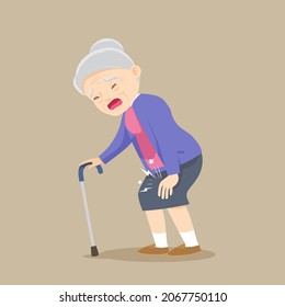 Elderly woman having a knee pain and standing with a walking cane.Grandmother with knee pain