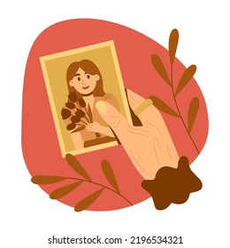 Elderly woman holding photo of young woman