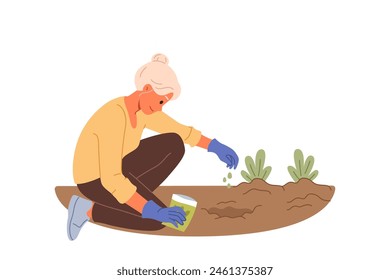 Elderly woman plants seeds in ground, planting flowers in garden or backyard of house. Old lady with seeds gets involved in vegetable gardening as hobby or saving money by getting fresh organic food