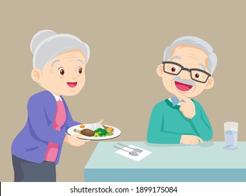 elderly Woman serving food to elderly man, Lovely grandmother serving food to grandfather, family enjoy cooking.