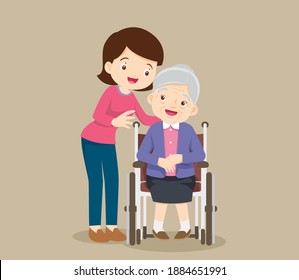 elderly woman sit in a wheelchair and the daughter tenderly puts  hands on her shoulders.Daughter cares for mother.Careful caregiver taking care of the patient