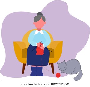 An elderly woman sits in a chair and knits, a cat sleeps near an elderly woman