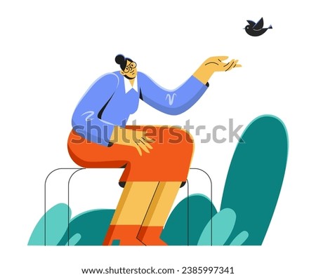 An elderly woman is sitting on a park bench and feeding birds. Leisure of an old man in a nursing home. Happiness and nature [[stock_photo]] © 
