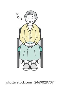 Elderly woman sleeping while sitting in a chair