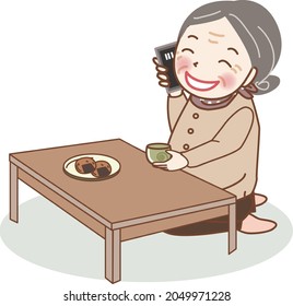 An elderly woman talking on her smartphone while eating a snack.
