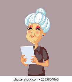 Elderly Woman Using a Pc Tablet Vector Cartoon. Happy cheerful grandmother making a video call on social media 
