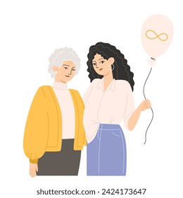 An elderly woman and a young woman are hugging and holding a balloon with a golden infinity symbol for Autism Awareness Day