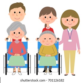 Elderly women sitting in a wheelchair and care giver