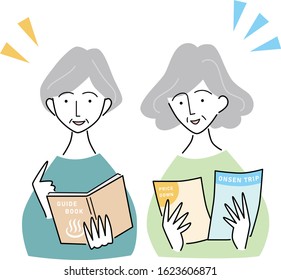 elderly women who are talking while looking at a book and fliers