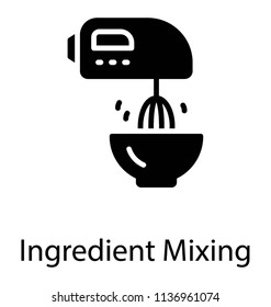 An electric beater moving in a bowl for mixing ingredients 