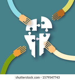 Electric bulb. Puzzles in the form of a light bulb. Concept of big idea. People hand holding shaes. Work together. Business idea. Teamwork. Strategy.