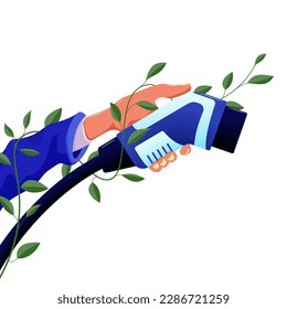 An electric car charging cable in a hand entwined with a green plant with leaves.