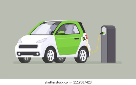 The electric car is recharged at the charging station. Vector illustration in a flat style The electric car is recharged at the charging station. Vector illustration in a flat style