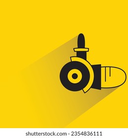 electric grinder with shadow on yellow background