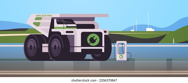 electric mining dumper industrial truck charging parking at the charger station with a plug in cable electrified transportation