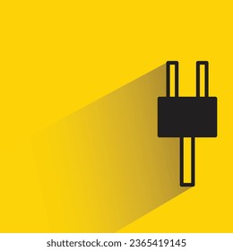electric plug with shadow on yellow background