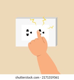 Electric risk with children, kid's hand playing with power socket concept.