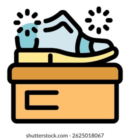 Electric shoe buffer polishing footwear on box, creating sparkling clean surface, perfect for shoe care and maintenance