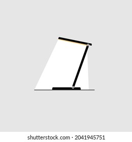 Electric table lamp isolated on gray background. Table lamp with beam of light for office and home work.