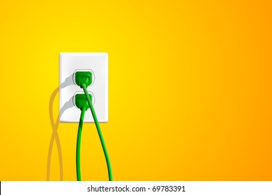 Electrical outlet with two green plugs and lots of copy space on the right.