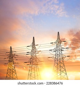 Electrical pylons over sunset background. Vector illustration.