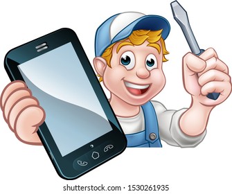 An electrician or handyman holding a screwdriver and phone with copyspace