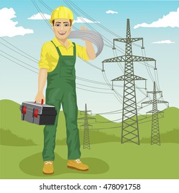 electrician man standing near high voltage power lines in summer