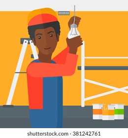 Electrician twisting light bulb.