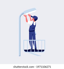 Electrician worker do electric works. Professional technician standing on lift performs street lamp maintenance service. Flat cartoon vector illustration.