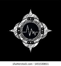 electrocardiogram icon drawn on a blackboard
