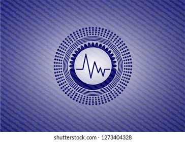 electrocardiogram icon inside badge with denim background