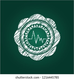 electrocardiogram icon inside chalkboard emblem written on a blackboard