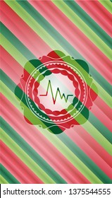 electrocardiogram icon inside christmas colors emblem.